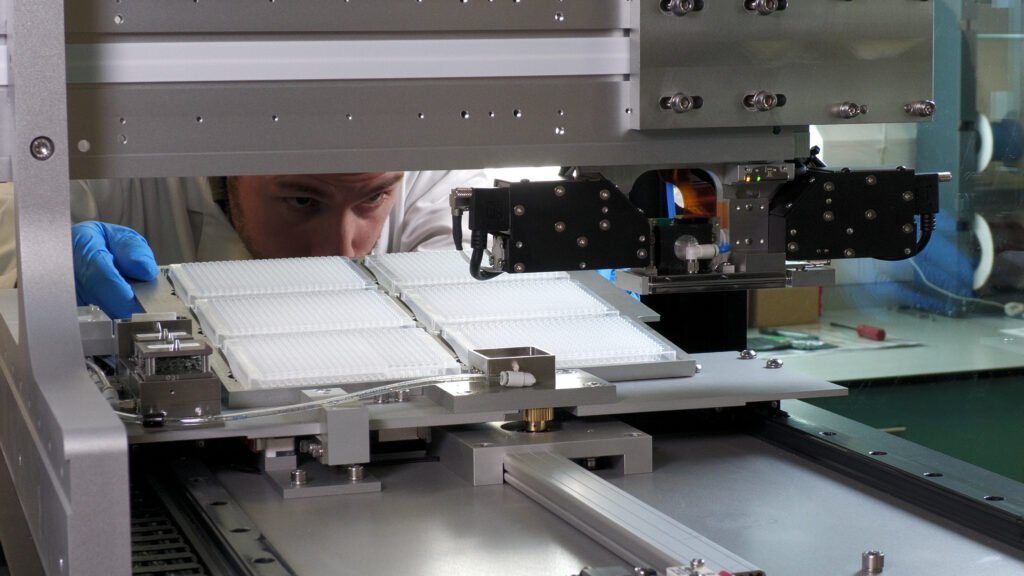 Arrayjet scientist loading samples into Mercury microarray printer
