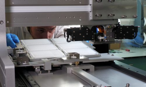 Arrayjet scientist loading samples into Mercury microarray printer